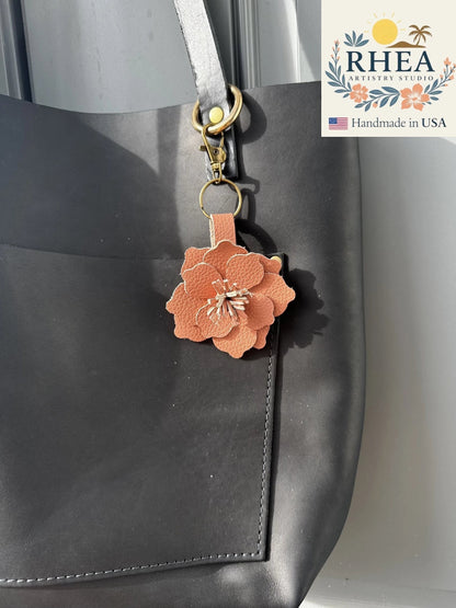Rhea Artistry Studio peach leather flower charm with tan and pink hues, featuring a lobster clasp and split ring.