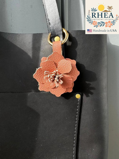 Rhea Artistry Studio peach leather flower charm with tan and pink hues, featuring hand-cut stamens and a versatile closure.