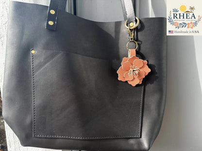 Rhea Artistry Studio peach fizz leather flower charm with tan and pink hues, featuring hand-cut stamens and a lobster clasp.