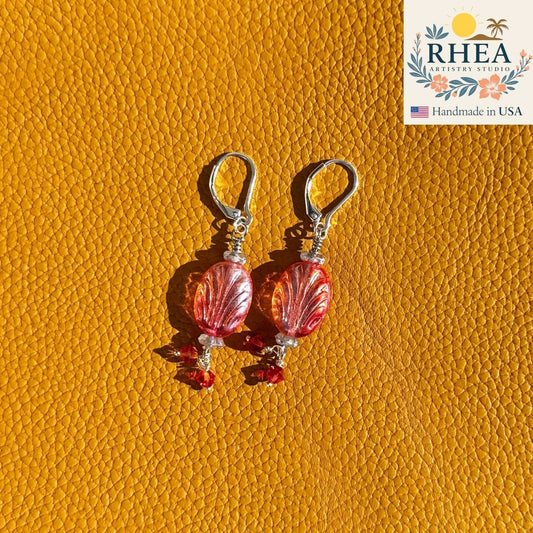 Rhea Artistry Studio Phoenix Flame earrings with oval red-orange Czech glass beads and red crystal accents, silver lever-back closures.