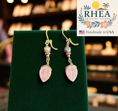 Rhea Artistry Studio pink leaf Czech glass earrings with iridescent beads and bronze accents, approx. 2 inches long.