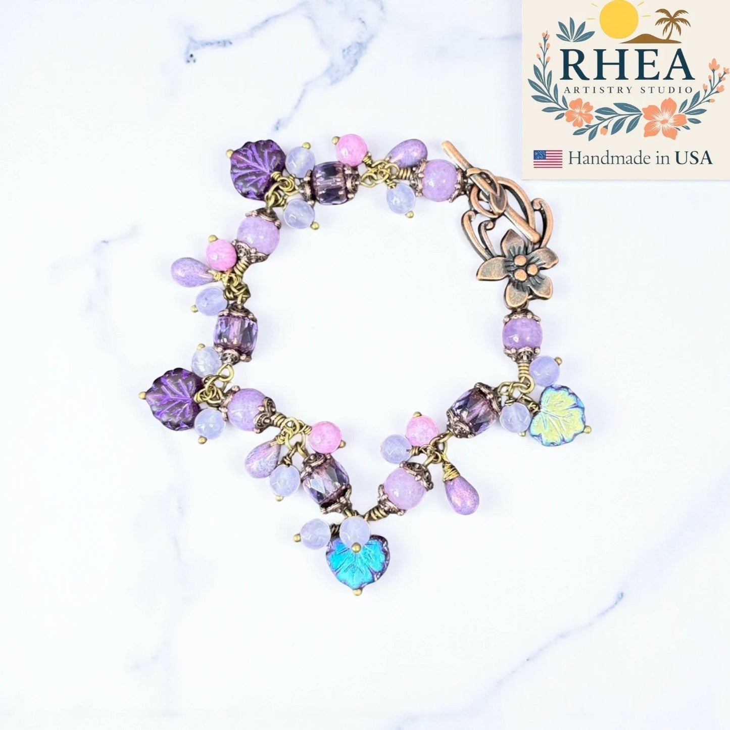 Rhea Artistry Studio handmade bracelet with lavender, lilac, and periwinkle glass beads and antique brass accents.
