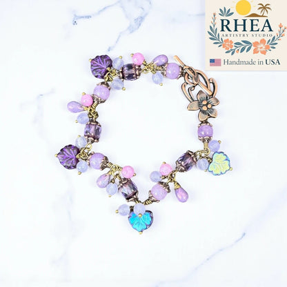 Rhea Artistry Studio handmade bracelet with lavender, lilac, and periwinkle glass beads and antique brass accents.