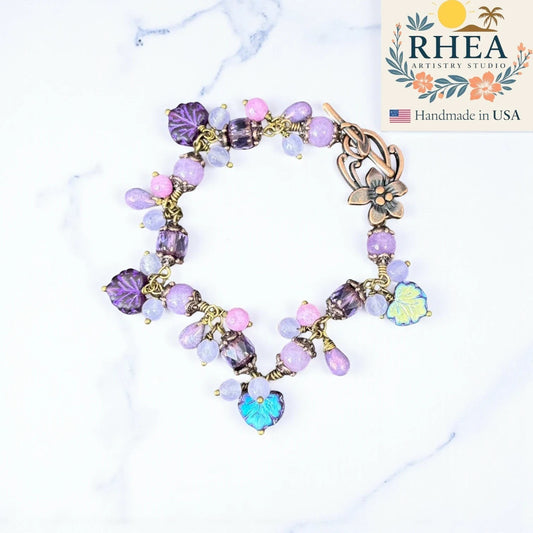 Rhea Artistry Studio handmade bracelet with lavender, lilac, and periwinkle glass beads and antique brass accents.