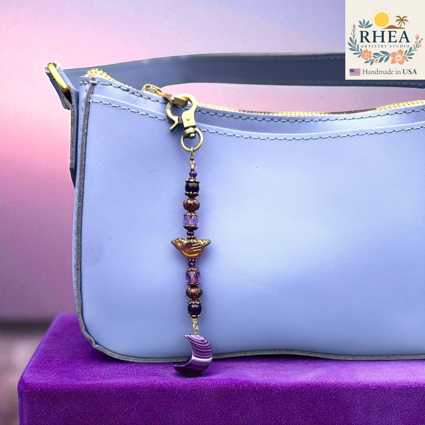 Rhea Artistry Studio purple gemstone and Czech bead bag charm with crescent moon pendant and brass clasp.