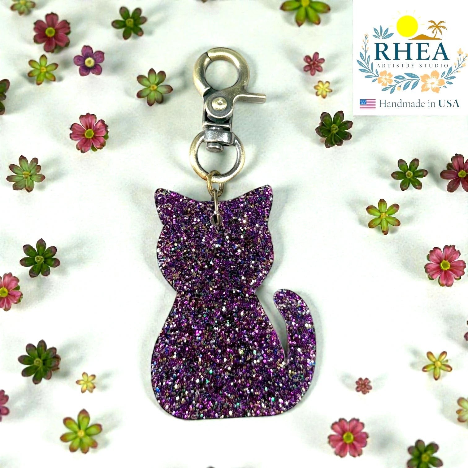 Rhea Artistry Studio purple glitter cat silhouette acrylic charm with antique brass clasp, perfect for bags or keys.