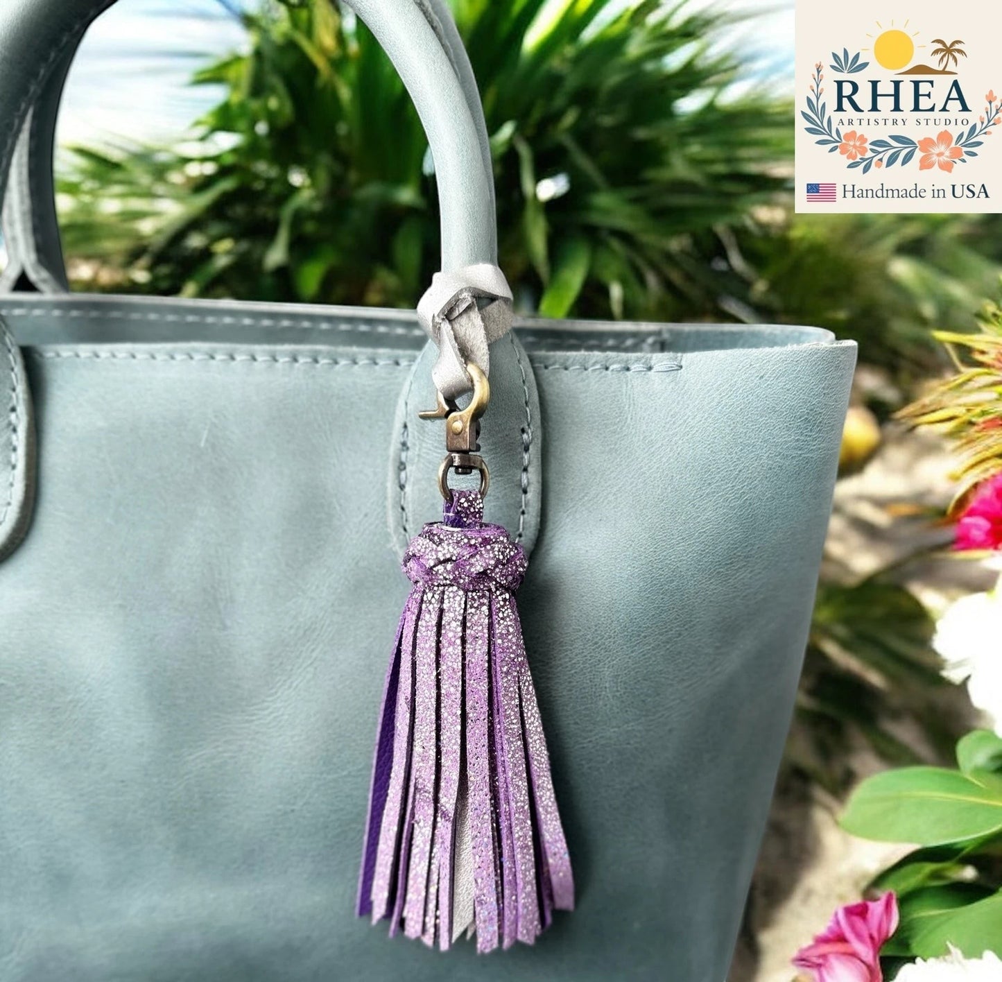 Rhea Artistry Studio handmade purple glitter leather tassel bag charm with lobster clasp.