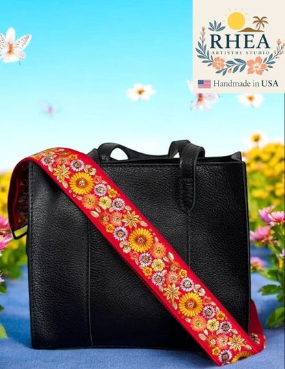 Rhea Artistry Studio red 2-inch wide strap with embroidered yellow and pink flowers, adjustable for purses and crossbody bags.