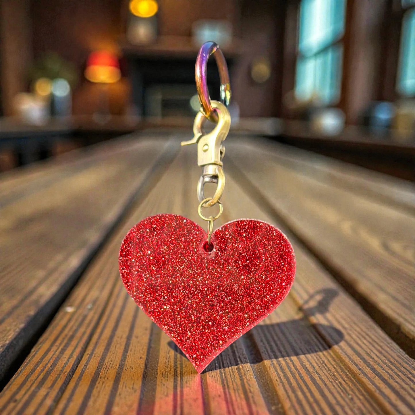 Rhea Artistry Studio red glitter heart charm with antique brass clasp, 3 inches long.