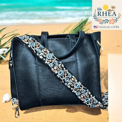 Rhea Artistry Studio black leather handbag with a 1.5-inch seafoam embroidered floral crossbody strap