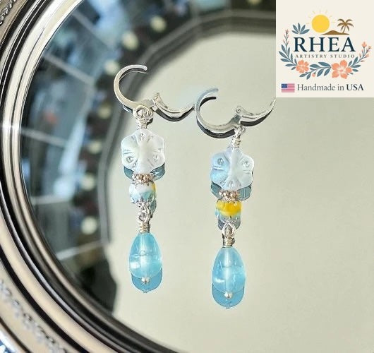 Rhea Artistry Studio handmade silver drop earrings with blue gemstones and Czech glass beads, 1.5 inches long.