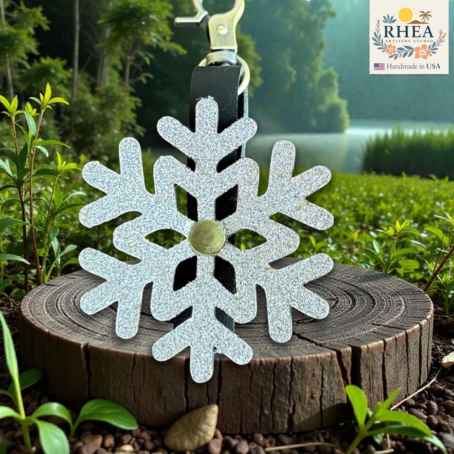 Rhea Artistry Studio silver glitter snowflake leather bag charm with brass hardware, handmade in USA.