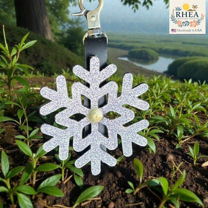 Rhea Artistry Studio silver glitter snowflake leather charm with brass hardware, handmade in USA.