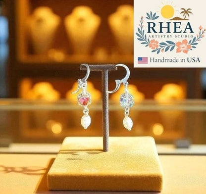 Rhea Artistry Studio silver pearl drop earrings with cathedral glass beads and luminous pearl accents, 1.5 inches long.
