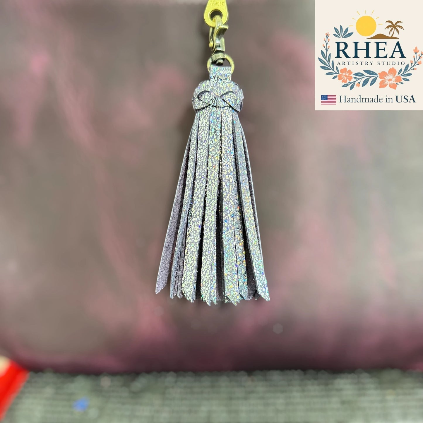 Rhea Artistry Studio handmade sparkly silver leather tassel keychain with antique brass lobster clasp.