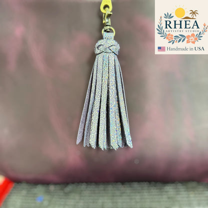 Rhea Artistry Studio handmade sparkly silver leather tassel keychain with antique brass lobster clasp.