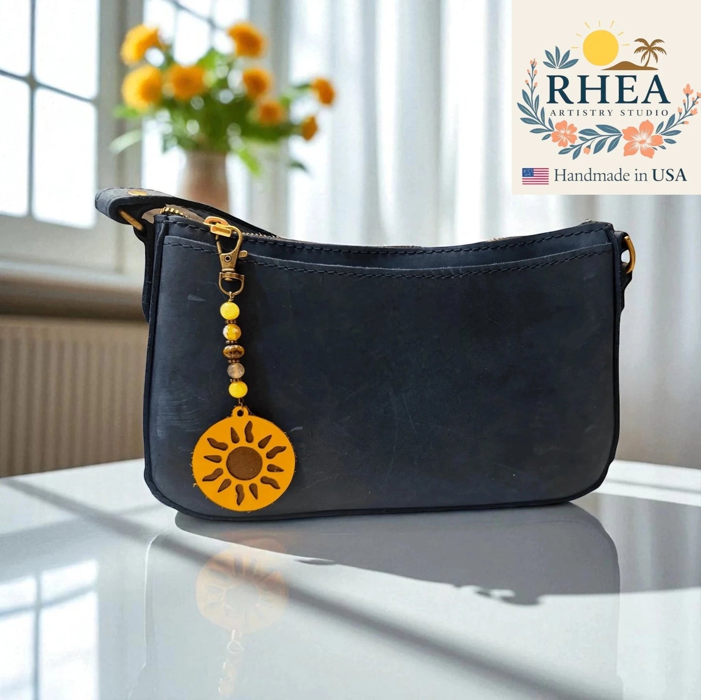 Rhea Artistry Studio handmade sun charm bag accessory with yellow gemstone and Czech glass beads, and leather sun pendant.