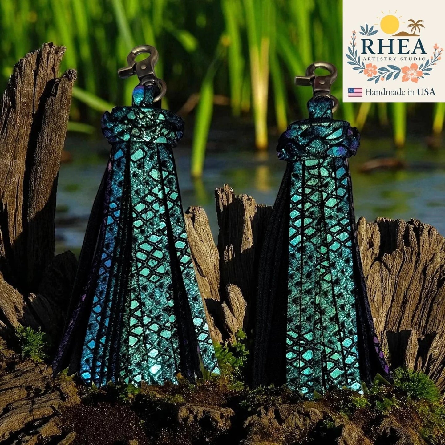Rhea Artistry Studio handmade teal iridescent leather tassel keychain with lobster clasp, approx. 5 inches long.