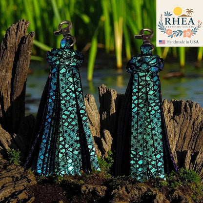 Rhea Artistry Studio handmade teal iridescent leather tassel keychain with lobster clasp, approx. 5 inches long.