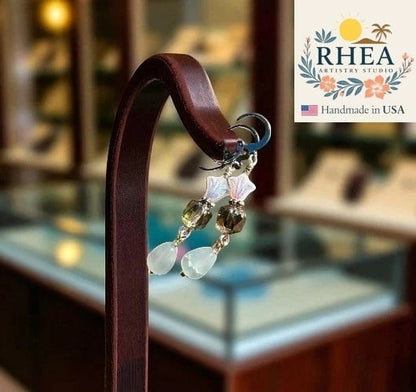 Rhea Artistry Studio white and silver three petal cathedral drop earrings with gemstone teardrop.