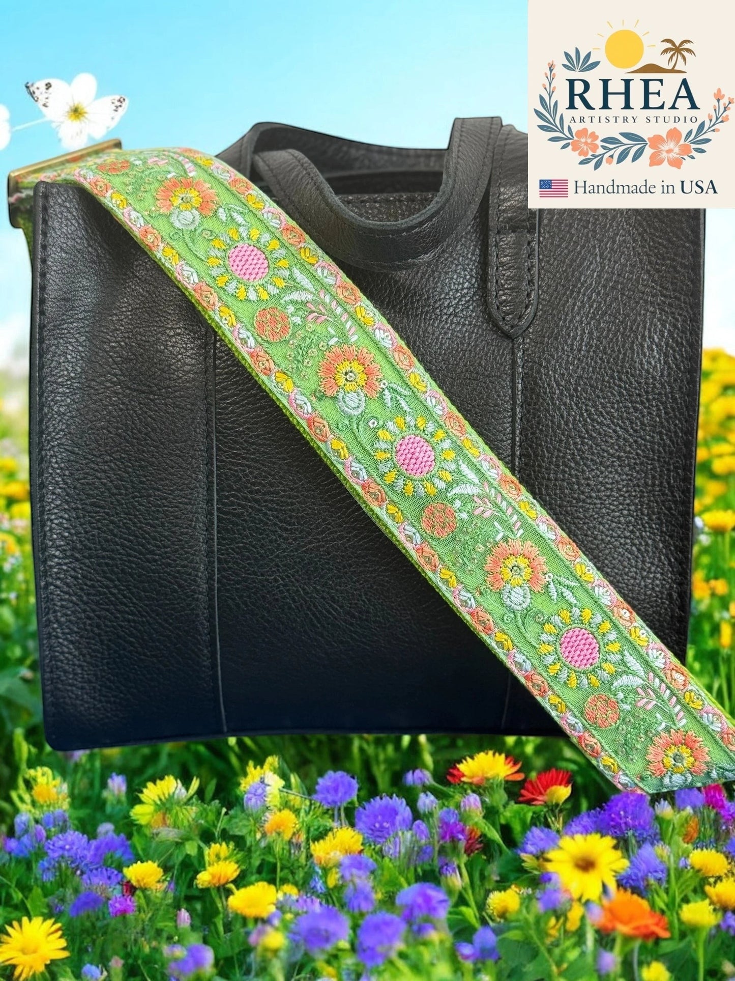 Rhea Artistry Studio green crossbody strap with zinnia embroidery, adjustable, 2-inch wide, with brushed brass hardware.