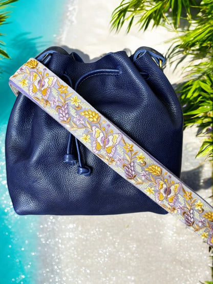 purple strap on a purple bag