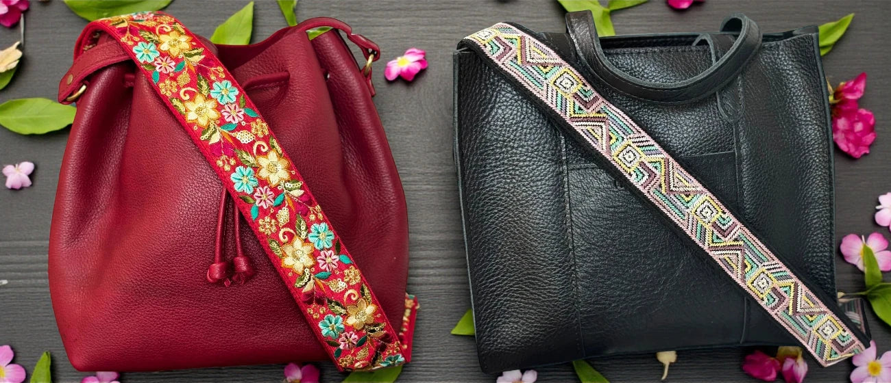 Two leather bags with colorful straps on a floral background