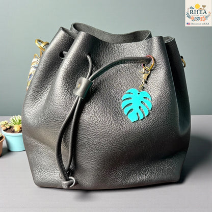 Mini acrylic monstera bag charm with antique brass clasp