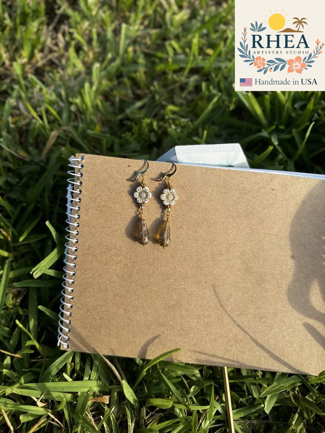 Floral-inspired White Hibiscus Gold Drop earrings handcrafted with Czech beads, artisan jewelry with golden accents.